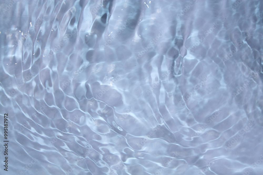 White water with ripples on the surface. Defocus blurred transparent white colored clear calm water surface texture with splashes and bubbles. Water waves with shining pattern texture background. White water with ripples on the surface. Defocus blurred transparent white colored clear calm water surface texture with splashes and bubbles. Water waves with shining pattern texture background.