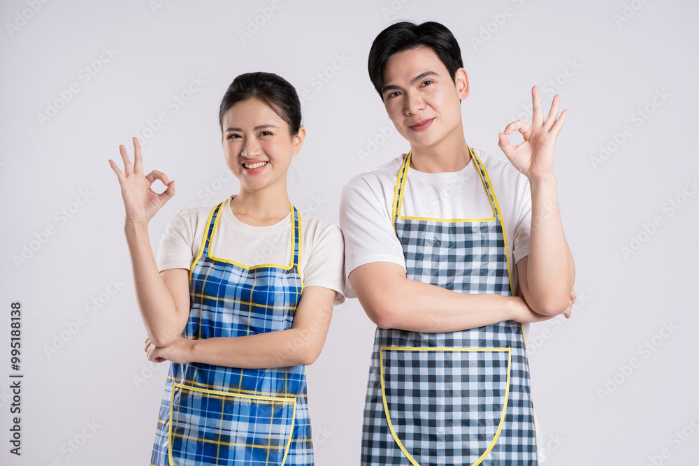 Image of Asian couple posing on white background. Image of Asian couple posing on white background.