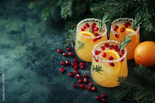 Christmas drinks with cranberries, oranges, and pine branches, festive setting
