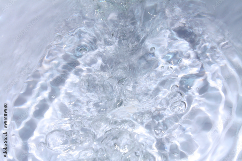 White water with ripples on the surface. Defocus blurred transparent white colored clear calm water surface texture with splashes and bubbles. Water waves with shining pattern texture background. White water with ripples on the surface. Defocus blurred transparent white colored clear calm water surface texture with splashes and bubbles. Water waves with shining pattern texture background.