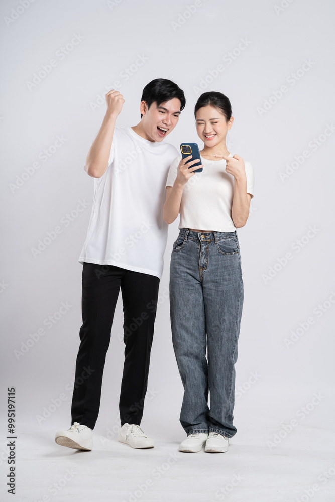 Image of Asian couple posing on white background. Image of Asian couple posing on white background.