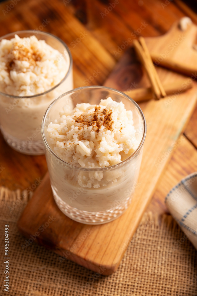 Rice pudding. Sweet dish made by cooking rice in milk and sugar, some recipes include cinnamon, vanilla or other ingredients, it is a very easy dessert to make and very popular all over the world. Rice pudding. Sweet dish made by cooking rice in milk and sugar, some recipes include cinnamon, vanilla or other ingredients, it is a very easy dessert to make and very popular all over the world.