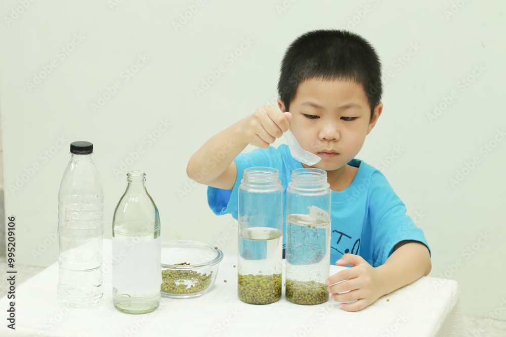 Easy science experiments at home to learn about for kids to learn the properties of carbon dioxide gas is lighter than water. Educational and learning concept for kids through play activities at home. Easy science experiments at home to learn about for kids to learn the properties of carbon dioxide gas is lighter than water. Educational and learning concept for kids through play activities at home.