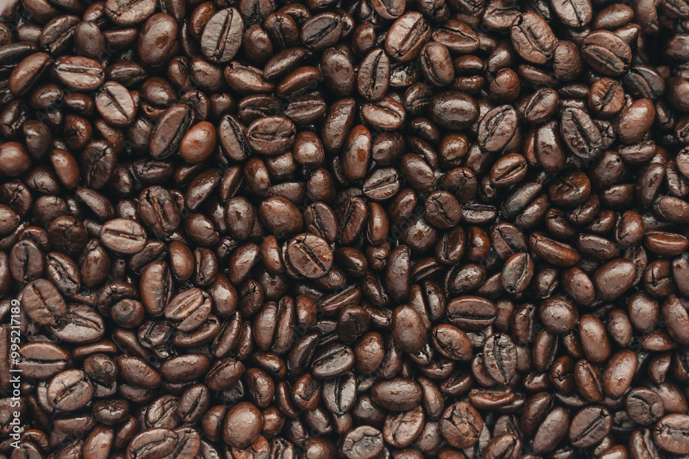 Naklejka premium Roasted Arabica coffee beans background,Dark Roast Coffee