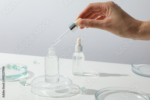 Transparent cosmetic bottles on a white background