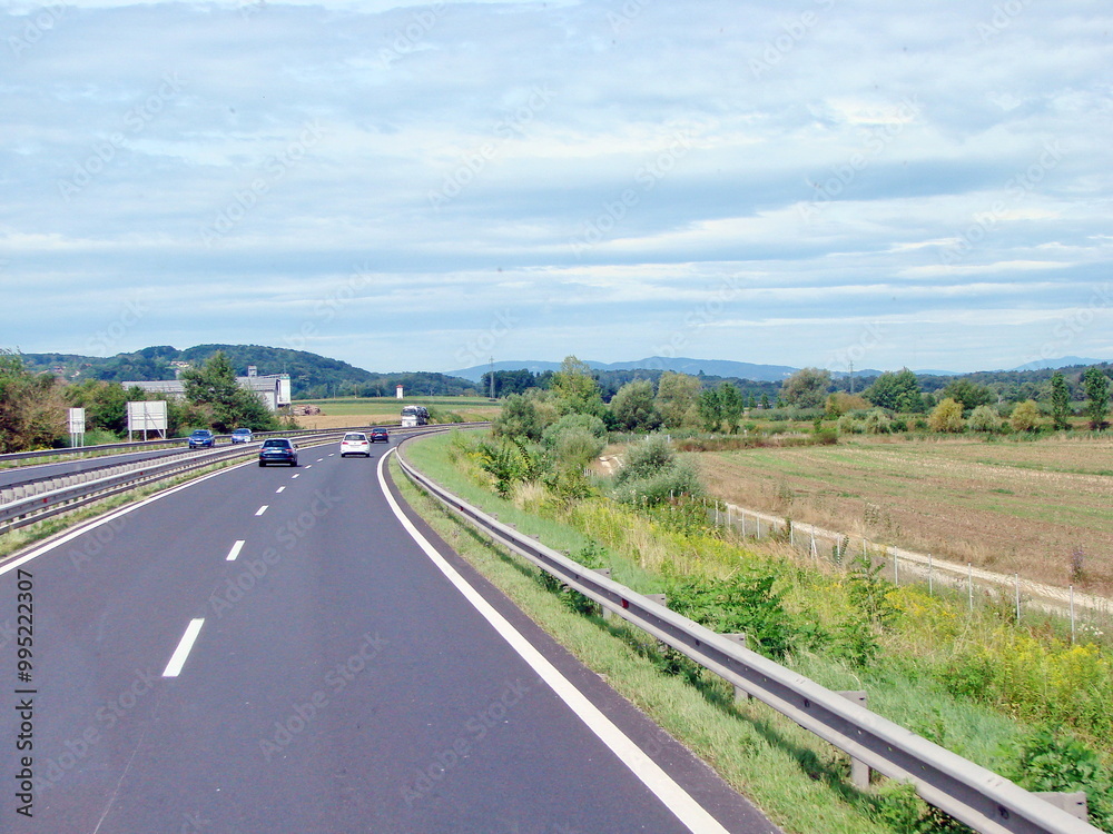 A view from the car window at the sky, which is quickly covered by a carpet of clouds. A view from the car window at the sky, which is quickly covered by a carpet of clouds.