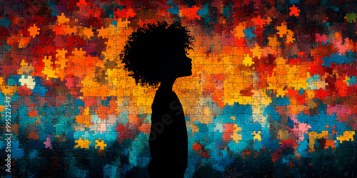 Silhouette of a child against a vibrant puzzle background, symbolizing the complexities of child psychology and development photo