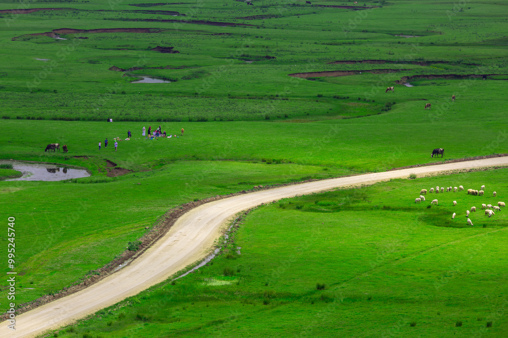 Meandering stream with mountains and clouds at The Persembe Plateau at Ordu, Turkey