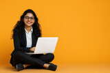 young indian business woman using laptop