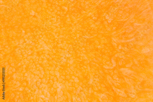 autumanl natural backdrop: close up of orange color pulp of pumpkin photo