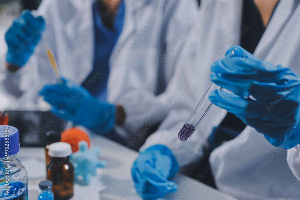 Scientist using microscope in laboratory. Close-up of a researcher's hands adjusting a modern microscope in a lab setting. Science concept Scientist using microscope in laboratory. Close-up of a researcher's hands adjusting a modern microscope in a lab setting. Science concept