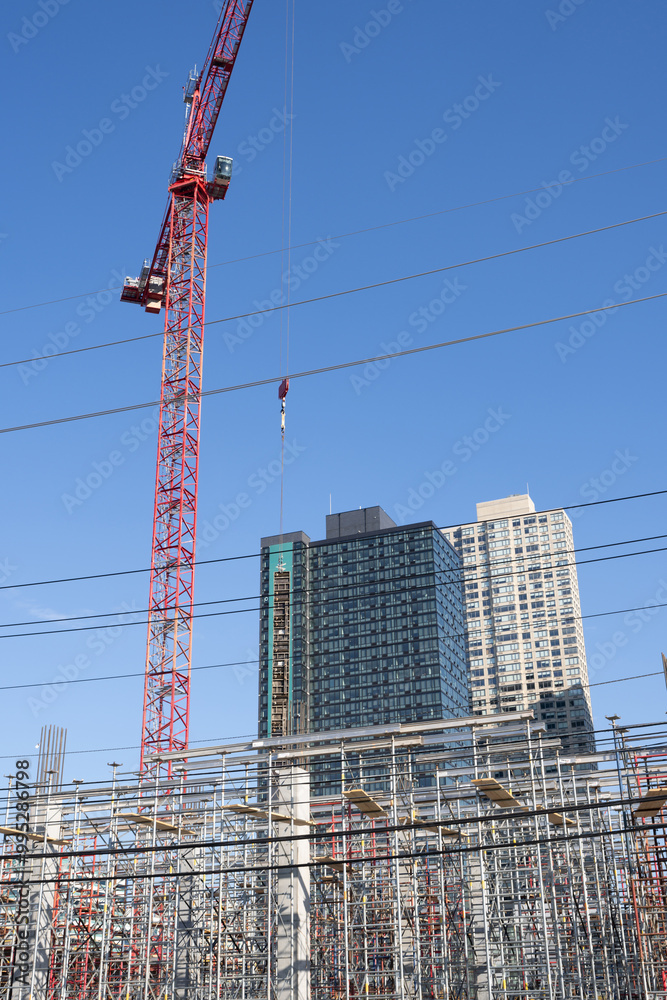 Crane on formworks. Crane and building construction. Construction crane on Housing. The crane. Industrial construction equipment against buildings. Tower Cranes. Construction site. Crane on formworks. Crane and building construction. Construction crane on Housing. The crane. Industrial construction equipment against buildings. Tower Cranes. Construction site.
