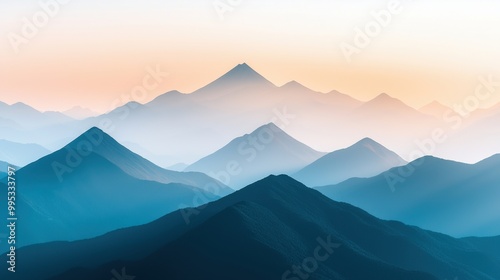 Serene mountain range with misty peaks at sunrise.