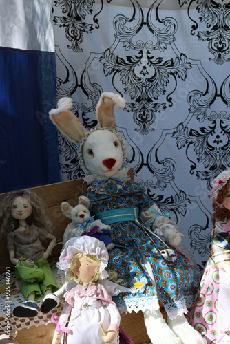 Wallpaper Mural soft toys - dolls and a bunny in fancy dresses are sold at the exhibition Torontodigital.ca