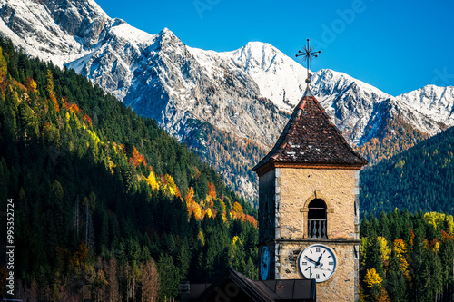 Autumn light on the Carnic Alps. Monte Coglians, Forni Avoltri and its colorful woods photo