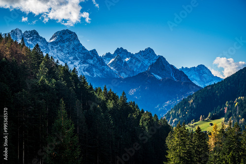 Autumn light on the Carnic Alps. Monte Coglians, Forni Avoltri and its colorful woods photo
