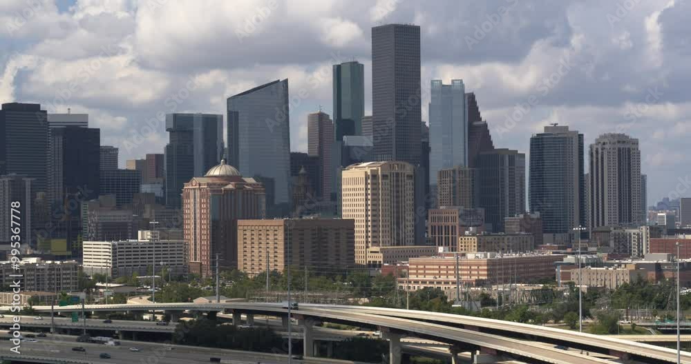Descending drone shot of downtown Houston and surrounding area Descending drone shot of downtown Houston and surrounding area