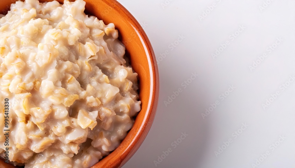 bowl of Porridge or oatmeal is a food made by heating or boiling ground, crushed or chopped starchy plants, typically grain, in milk or water. often with honey, sugar, milk, fruit added for flavor. bowl of Porridge or oatmeal is a food made by heating or boiling ground, crushed or chopped starchy plants, typically grain, in milk or water. often with honey, sugar, milk, fruit added for flavor.