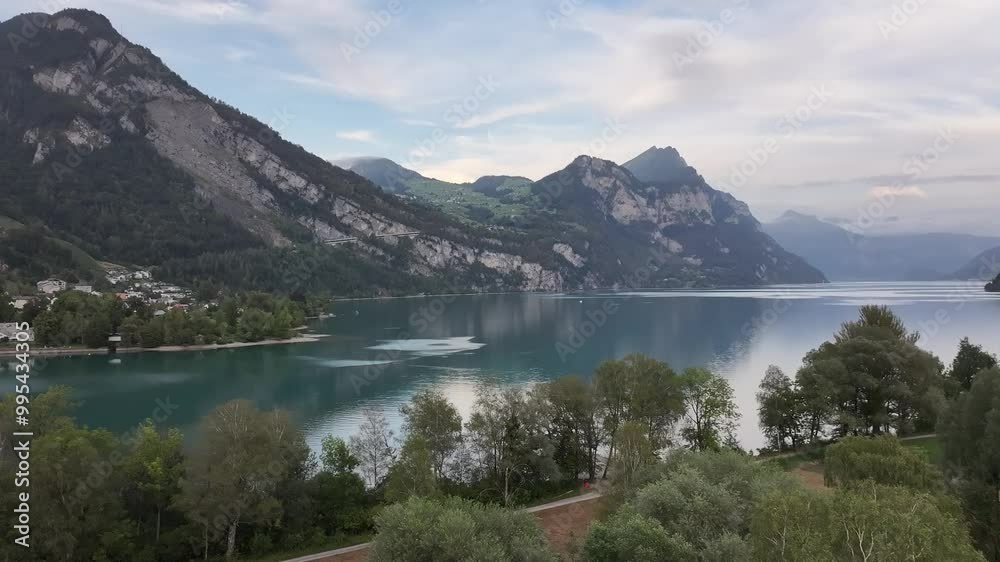 Panoramic aerial view of Lake Walensee, the deepest lake in the Swiss Alps. Panoramic aerial view of Lake Walensee, the deepest lake in the Swiss Alps.