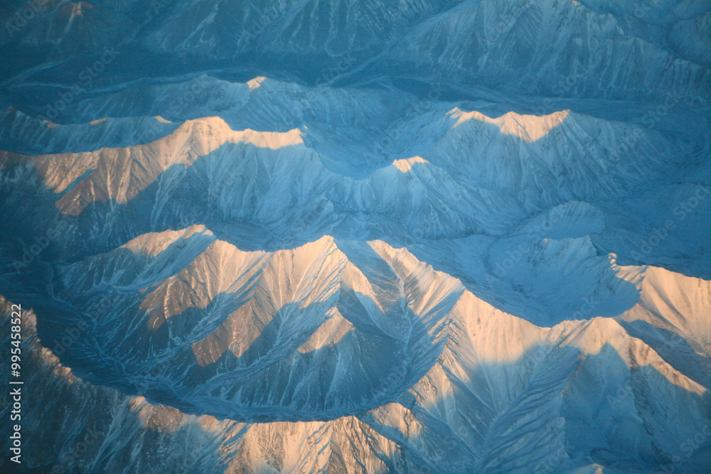 aerial view of the winter land from the flying airplane