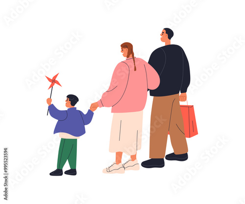 Family walking together. Parents and child with pinwheel toy, holding hands, ...
