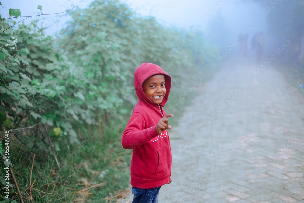 Portrait of a south asian young rural boy in foggy winter morning Portrait of a south asian young rural boy in foggy winter morning