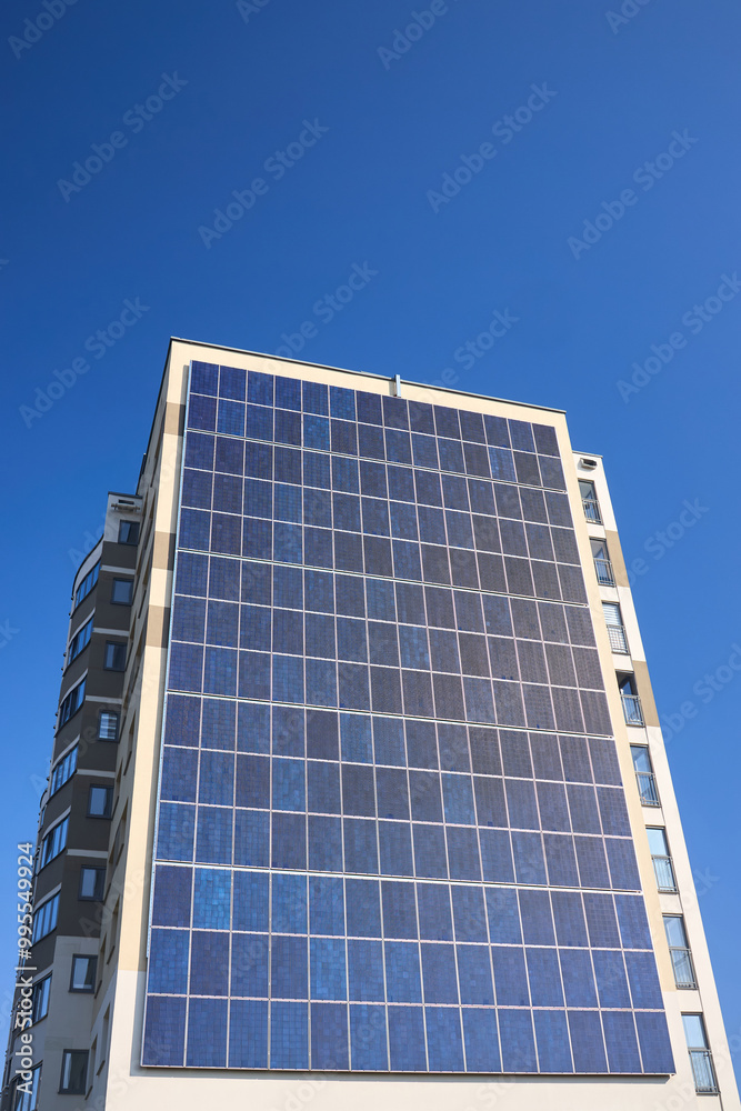 Many solar panels texture with copyspace. Building with lots of solar panels. Renewable solar energy. Alternative Generator Energy efficient house uses solar energy of sun. Many solar panels texture with copyspace. Building with lots of solar panels. Renewable solar energy. Alternative Generator Energy efficient house uses solar energy of sun.