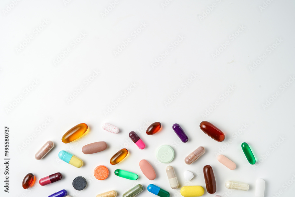 A lot of colorful medication pills capsules tablets softgel supplements, fish oil, vitamin, omega 3 A lot of colorful medication pills capsules tablets softgel supplements, fish oil, vitamin, omega 3
