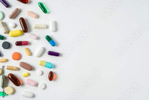 A lot of colorful medication pills capsules tablets softgel supplements, fish oil, vitamin, omega 3