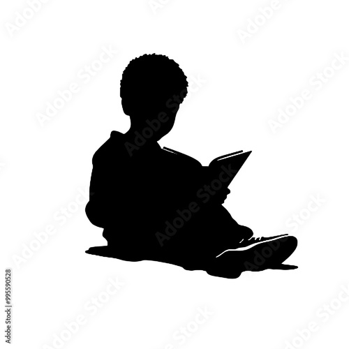 Silhouette of a young person reading a book