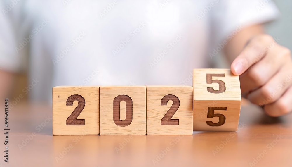 Naklejka premium wooden cubes flipping symbolizing business growth goals