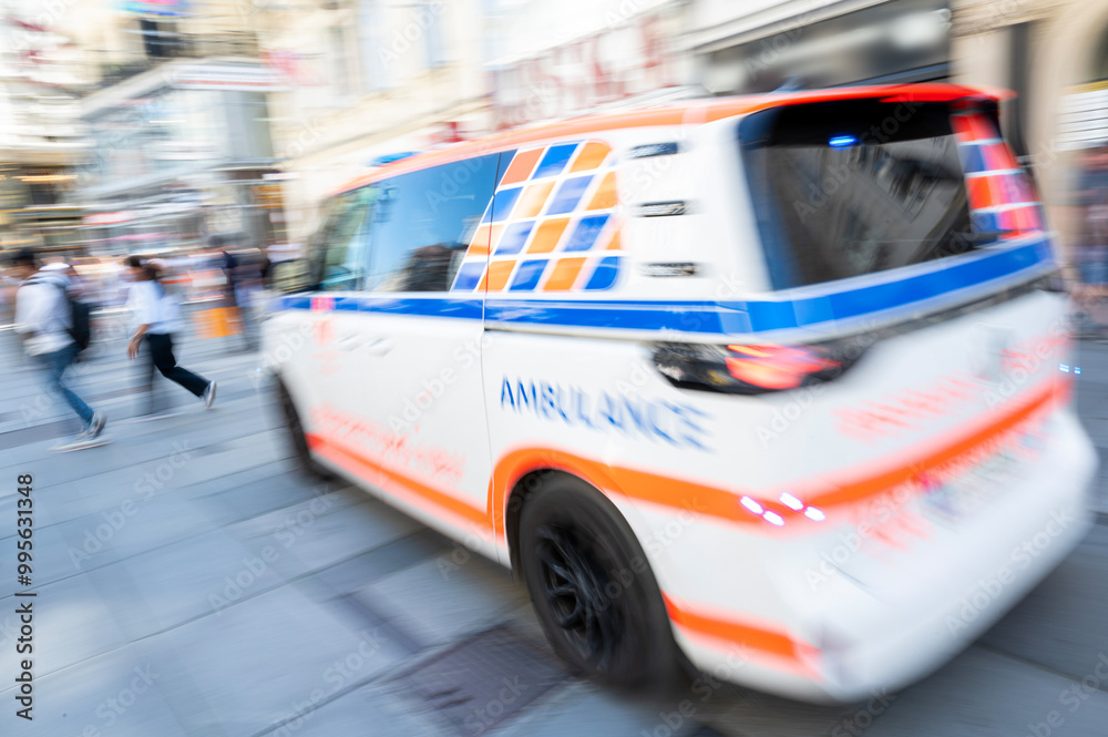 Ambulance in motion driving down the road