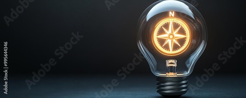 Electric light bulb with a glowing compass inside, surrounded by ambient darkness, representing direction, guidance, and the journey of inspiration