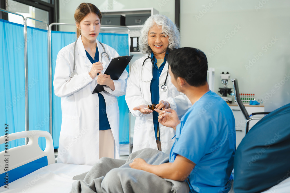 medicine, healthcare and people concept - doctor talking to male patient at bed in hospital.