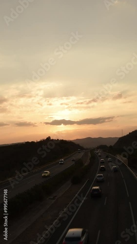 Sunset on a highway with cars circulating photo