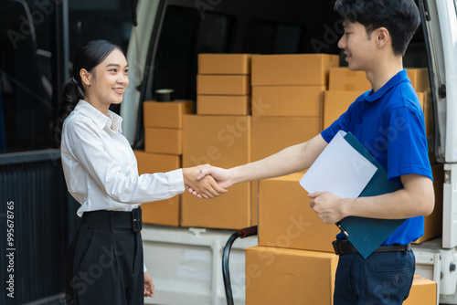 Asian delivery man deliver box parcel package to customer at home office, shipping delivery concept.