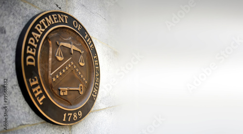 Symbol emblem of US Treasury Department in Washington. Concept of economy finance interest rate money business currency dollar financial wealth investment saving credit. Copy space for text.