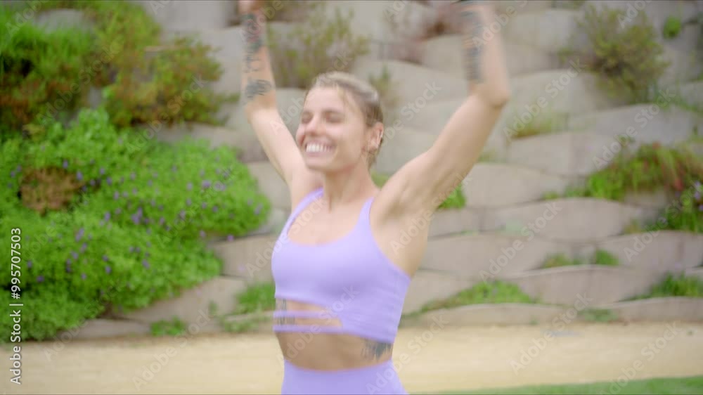 In a stunning natural setting, a young woman dressed in a vibrant purple outfit is joyfully exercising outdoors, radiating her fitness, abundant energy, and enthusiasm for a fulfilling life In a stunning natural setting, a young woman dressed in a vibrant purple outfit is joyfully exercising outdoors, radiating her fitness, abundant energy, and enthusiasm for a fulfilling life