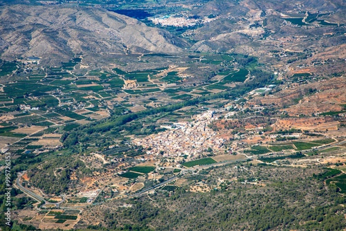 aerial of the mountains at Valencia and small villages with agricultural fields and industry like Gurrea del Gallego, province Huesca, Valencia, Spain