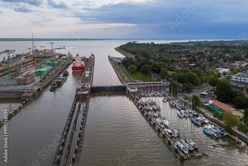 Aerial drone image of the lock complex sluice and port of Brunsbüttel under construction, the entrance of the nord ostsee kanal the Kiel canal from the north sea to the baltic cargo ship container photo