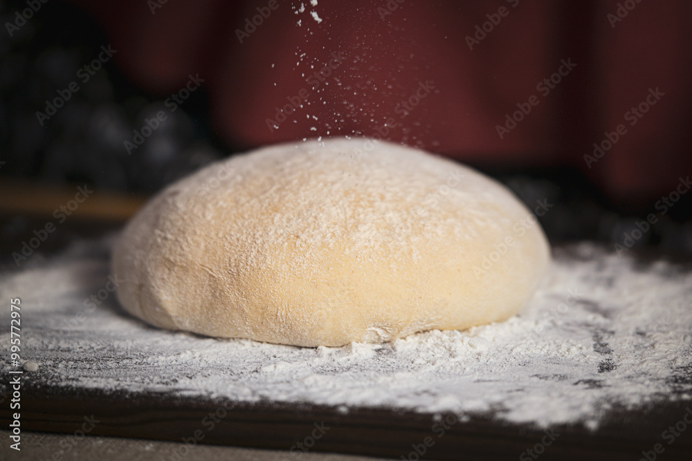 Yeast dough on the kitchen board, warm homely atmosphere. Yeast dough on the kitchen board, warm homely atmosphere.