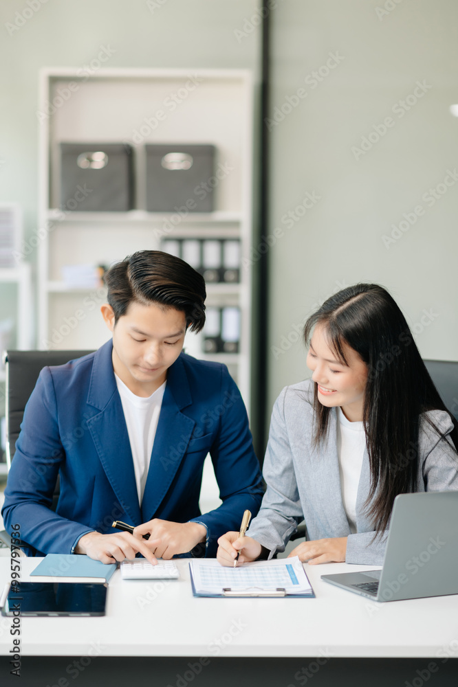 Businesswomen work and discuss their business plans. A Human employee explains and shows her colleague the results paper Businesswomen work and discuss their business plans. A Human employee explains and shows her colleague the results paper
