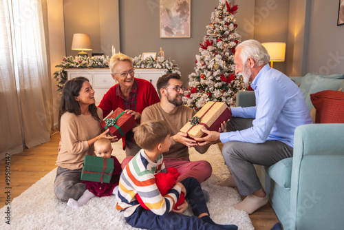 Fotografi Family exchanging Christmas presents