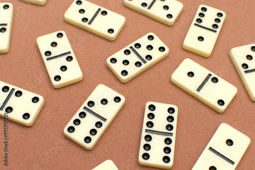 Dominoes bones on brown background 