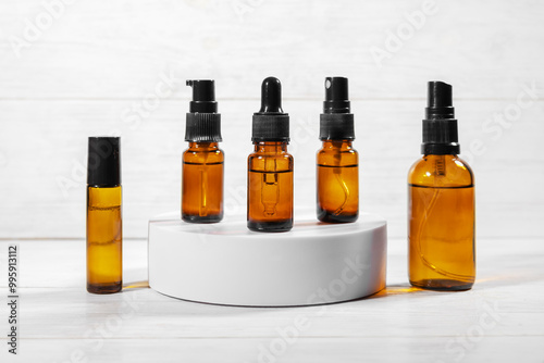 Amber glass bottles for cosmetics, natural medicine or essential oils isolated on a white background