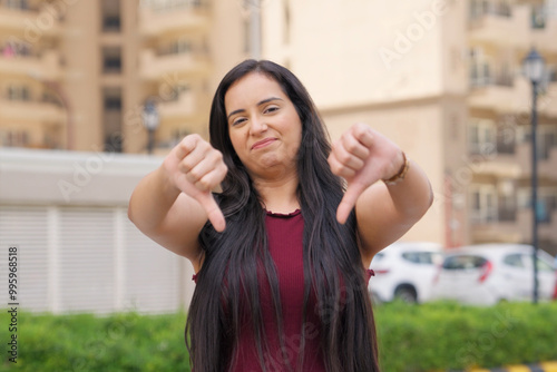 Indian Woman Showing Thumbs Down