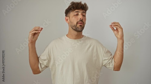 Young man making hand gestures over an isolated white background