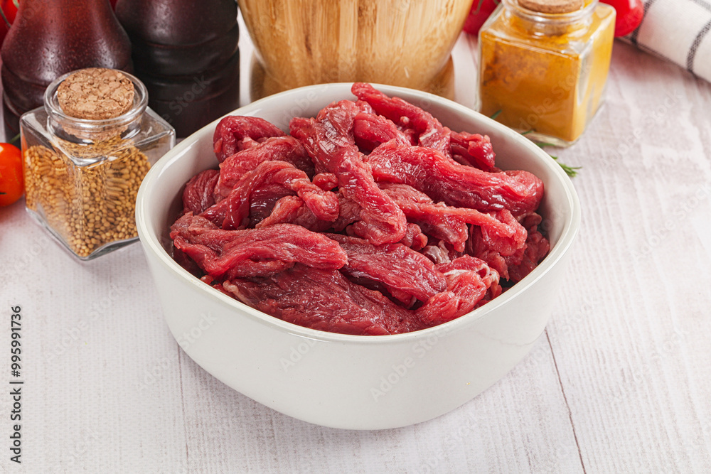 Raw beef meat - sliced strips Raw beef meat - sliced strips