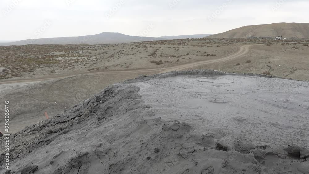 Gobustan, Azerbaijan Mud bubbling from landmark mud volcanoes out in the desert outside Baku. Gobustan, Azerbaijan Mud bubbling from landmark mud volcanoes out in the desert outside Baku.