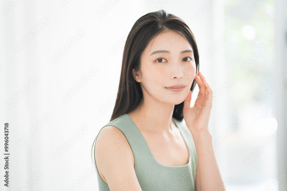 Skin care. Woman with beauty face touching healthy facial skin portrait. Asian woman.
Skin care. Woman with beauty face touching healthy facial skin portrait. Asian woman.